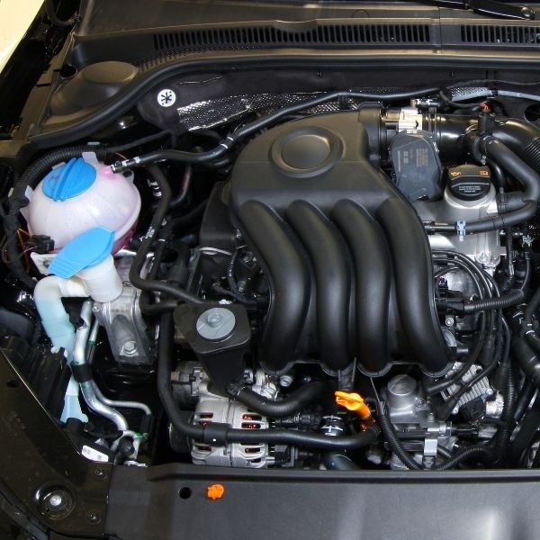 Under a car hood.